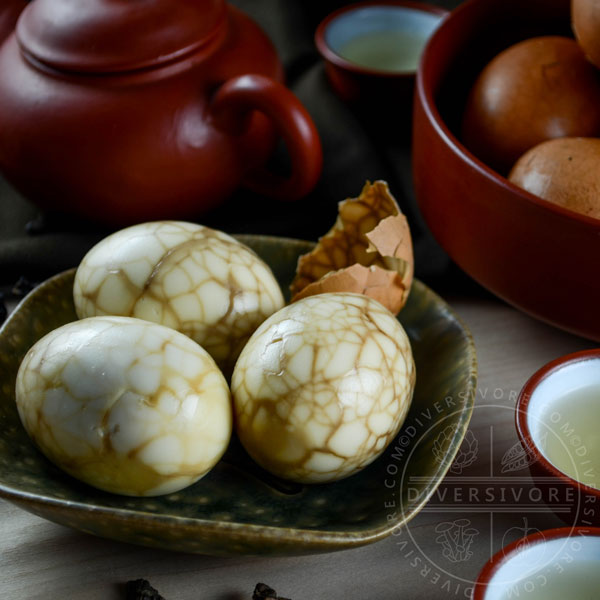 Peeled Taiwanese tea eggs on a ceramic dish