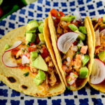 Chicken tinga, served as tacos with pico de gallo, avocados and cheese - Diversivore.com