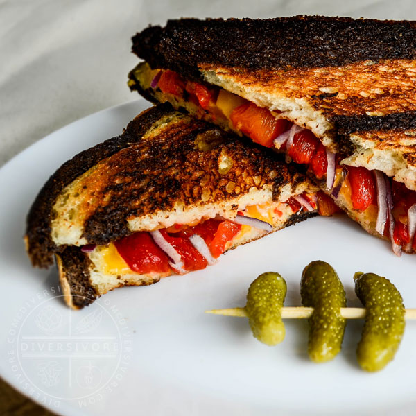 Pickled Pepper Grilled Cheese on marble rye with cornichons