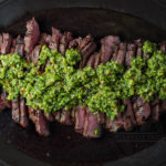 Garlic scape chimichurri served on grilled beef - Diversivore.com