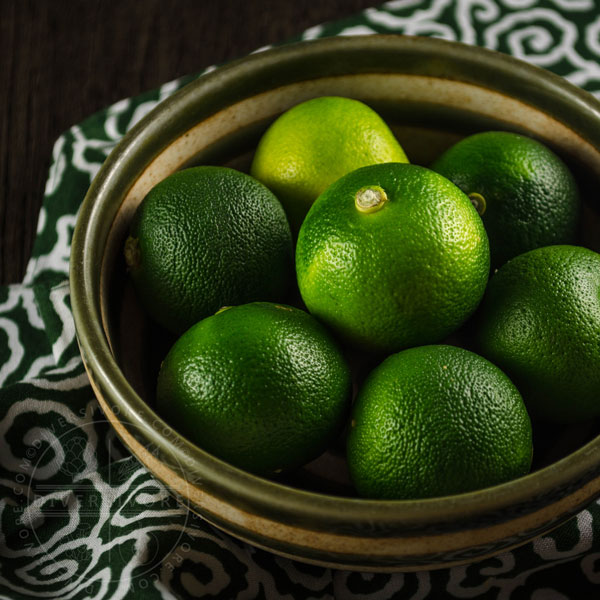 Sudachi fruits in a small ceramic bowl