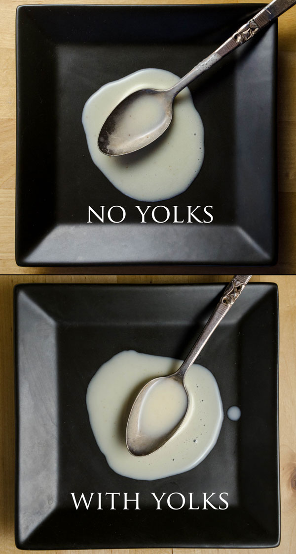 A vertical diptych showing the consistency of coquito made without eggs (top) and with eggs (bottom).  The egg-based coquito is slightly thicker.